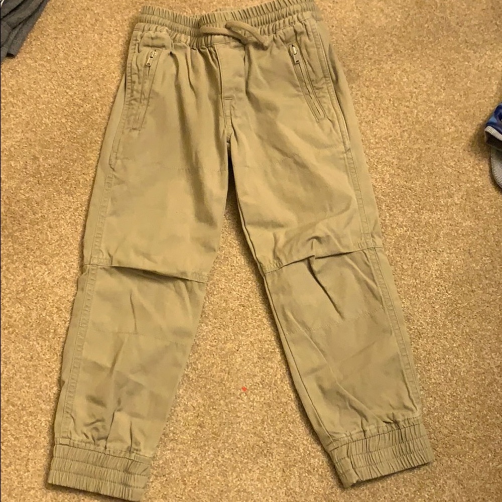 Tan pants with side zipper sand elastic on bottom